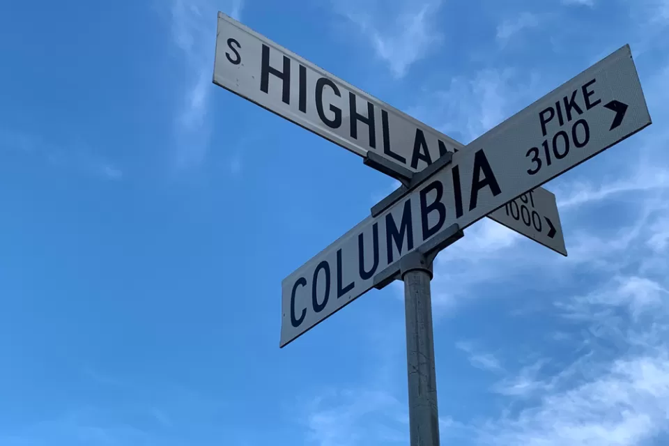 Street signs at the intersection of Columbia Pike and Highland in Arlington, Virginia.